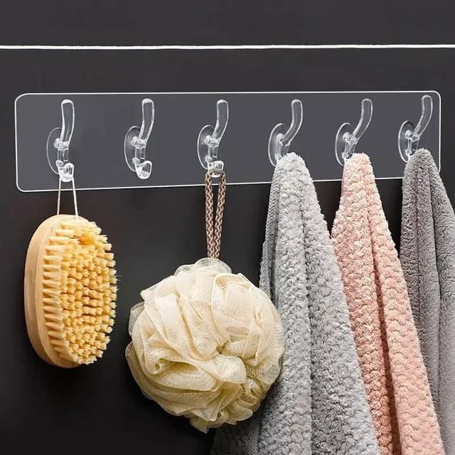 Transparent double sided self adhesive wall hook for hanging towels, kitchen utensils, keys and bathroom accessories.